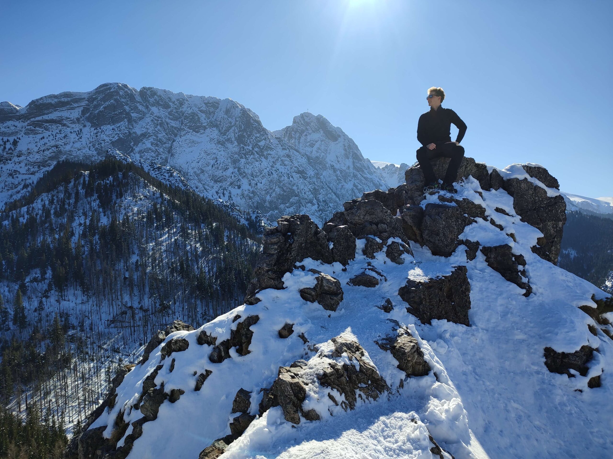 Author sitting on the top of mountain